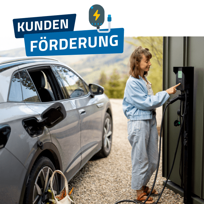 Frau lädt Elektroauto an Wallbox: Symbolbild für Förderung privater Ladestationen.